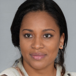 Joyful black young-adult female with medium  brown hair and brown eyes