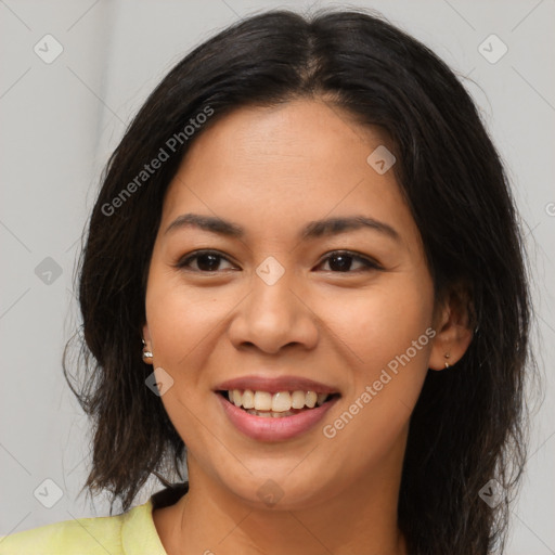 Joyful latino young-adult female with medium  brown hair and brown eyes