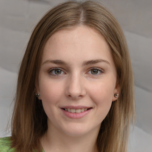 Joyful white young-adult female with long  brown hair and grey eyes