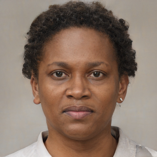 Neutral black adult female with short  brown hair and brown eyes