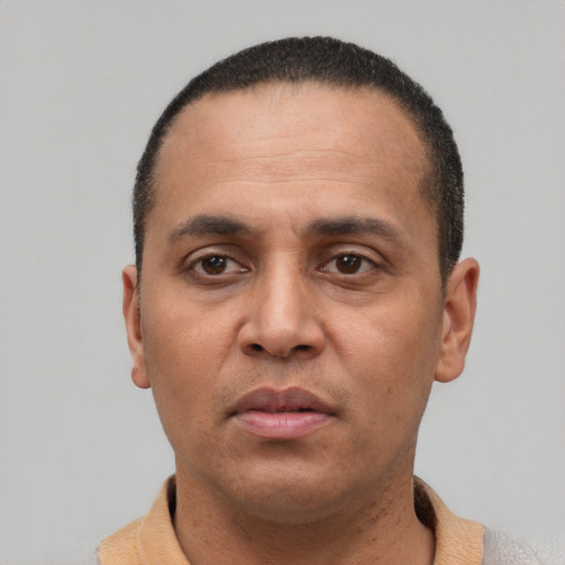 Neutral latino adult male with short  black hair and brown eyes