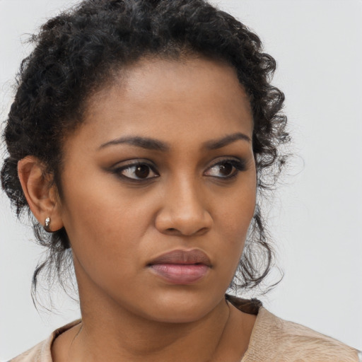 Neutral black young-adult female with short  brown hair and brown eyes