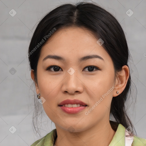 Joyful asian young-adult female with medium  black hair and brown eyes