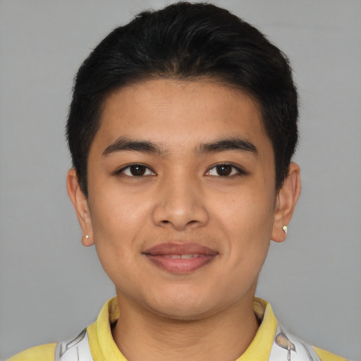 Joyful asian young-adult male with short  brown hair and brown eyes