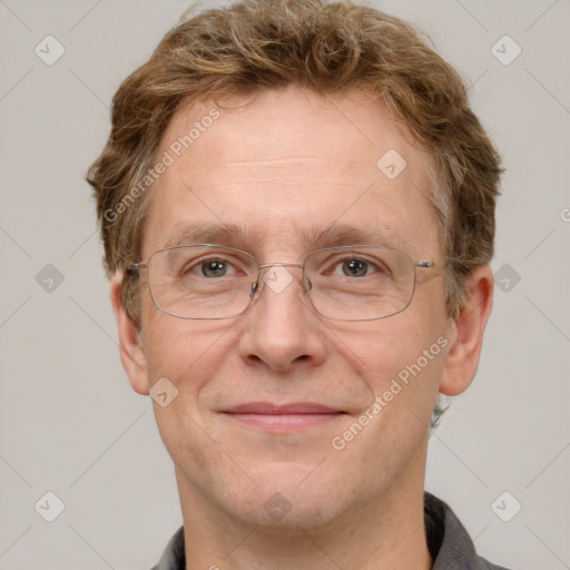 Joyful white adult male with short  brown hair and grey eyes