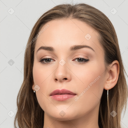 Neutral white young-adult female with long  brown hair and brown eyes