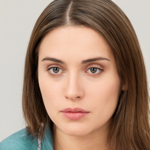 Neutral white young-adult female with long  brown hair and brown eyes