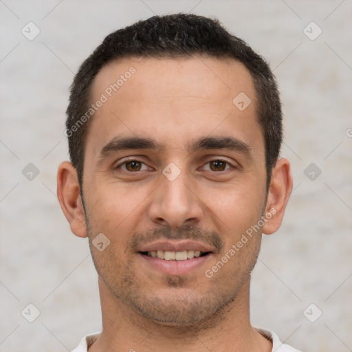 Joyful white young-adult male with short  black hair and brown eyes