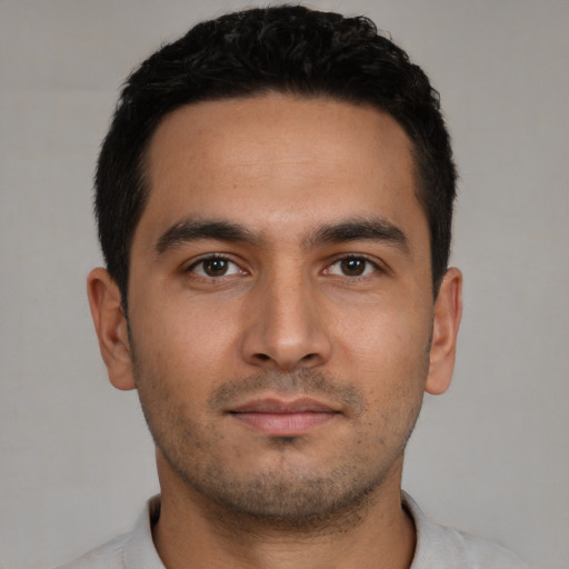 Neutral white young-adult male with short  black hair and brown eyes