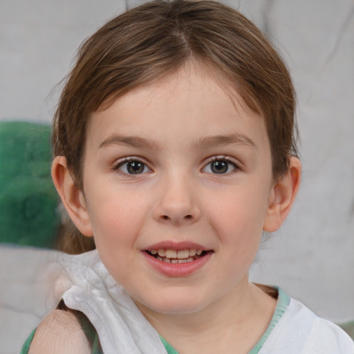 Joyful white child female with short  brown hair and brown eyes