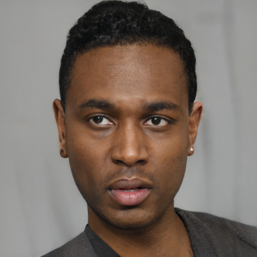 Neutral black young-adult male with short  black hair and brown eyes