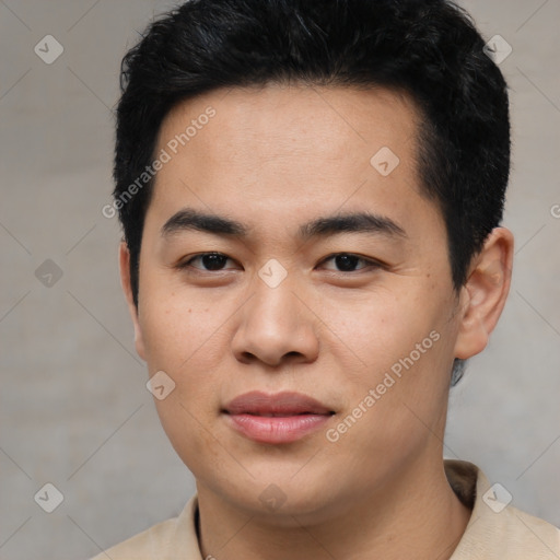 Joyful asian young-adult male with short  black hair and brown eyes