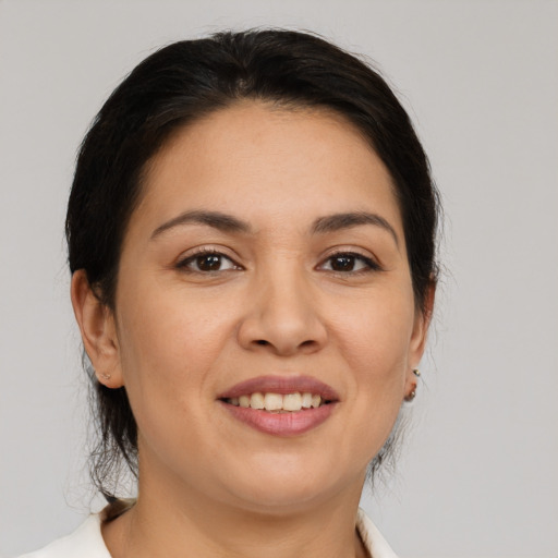 Joyful white young-adult female with medium  brown hair and brown eyes