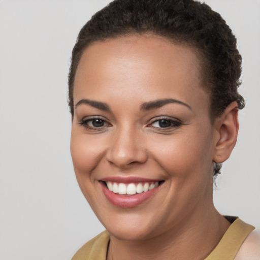 Joyful white young-adult female with short  brown hair and brown eyes