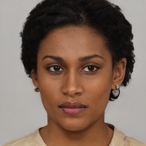 Neutral black young-adult female with short  black hair and brown eyes