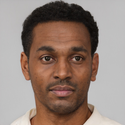 Neutral black young-adult male with short  black hair and brown eyes