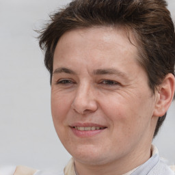 Joyful white adult female with short  brown hair and brown eyes