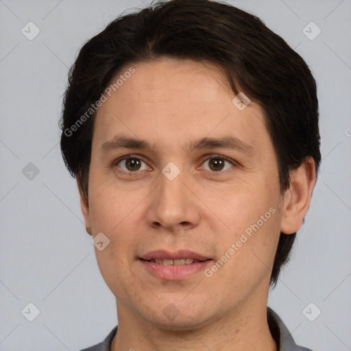 Joyful white adult male with short  brown hair and brown eyes