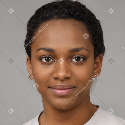 Joyful black young-adult female with short  black hair and brown eyes