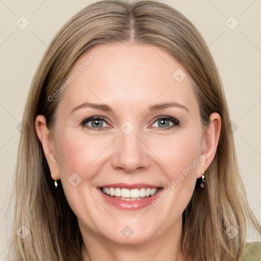 Joyful white adult female with long  brown hair and grey eyes