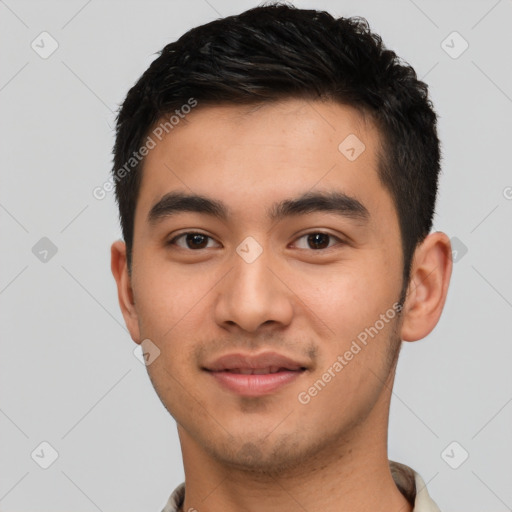 Joyful latino young-adult male with short  black hair and brown eyes