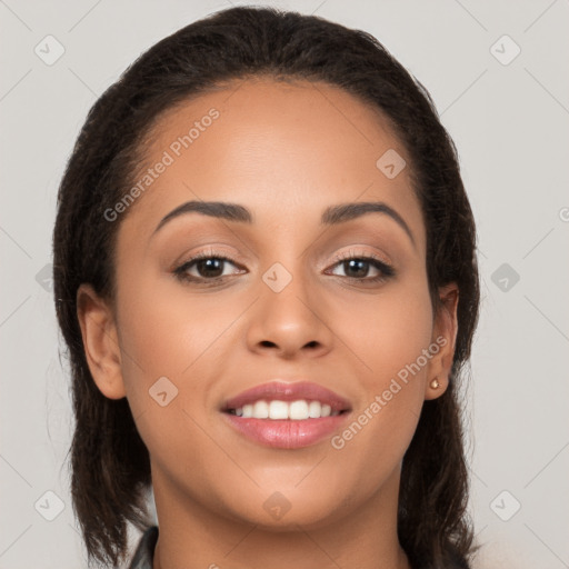 Joyful latino young-adult female with long  brown hair and brown eyes