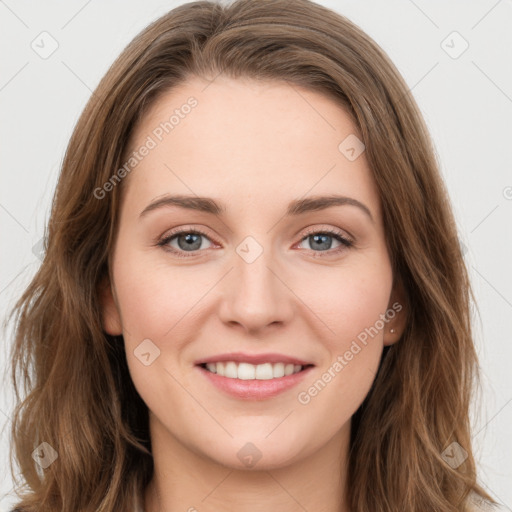 Joyful white young-adult female with long  brown hair and green eyes