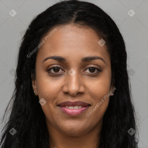 Joyful black young-adult female with long  brown hair and brown eyes