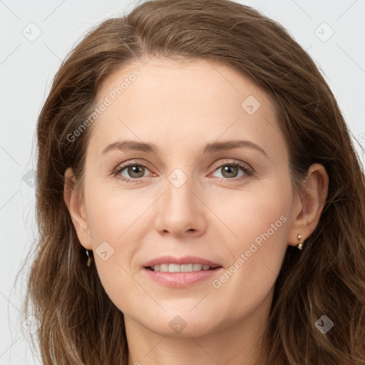 Joyful white young-adult female with long  brown hair and grey eyes