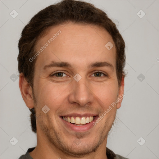 Joyful white adult male with short  brown hair and grey eyes