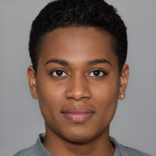 Joyful black young-adult female with short  black hair and brown eyes