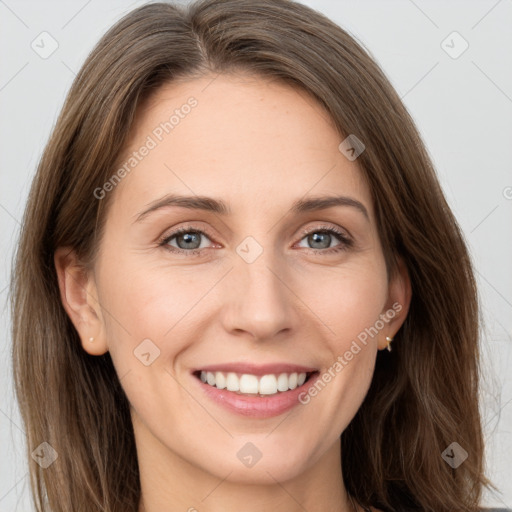 Joyful white young-adult female with long  brown hair and grey eyes