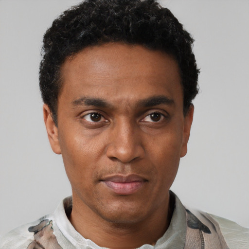 Neutral latino adult male with short  black hair and brown eyes