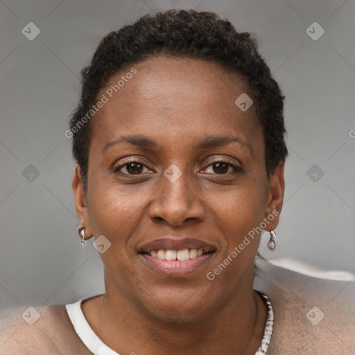 Joyful black adult female with short  brown hair and brown eyes