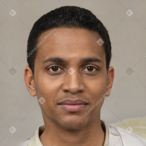 Joyful black young-adult male with short  black hair and brown eyes