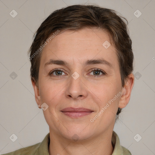 Joyful white adult female with short  brown hair and grey eyes