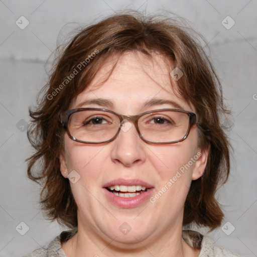 Joyful white adult female with medium  brown hair and blue eyes