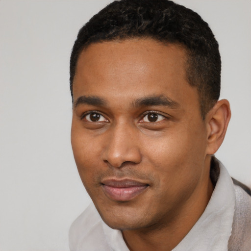 Neutral black young-adult male with short  black hair and brown eyes