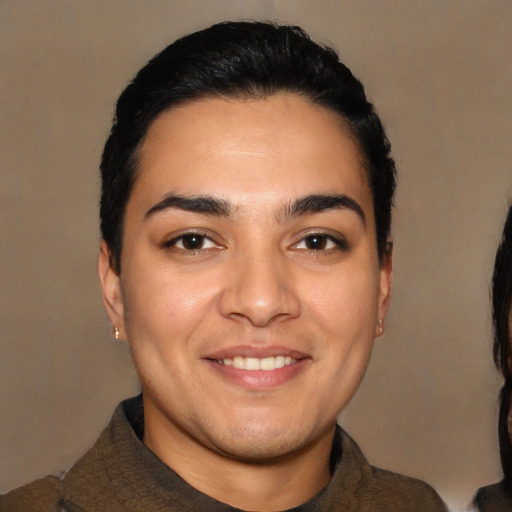 Joyful latino young-adult male with short  black hair and brown eyes