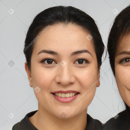 Joyful asian young-adult female with medium  brown hair and brown eyes