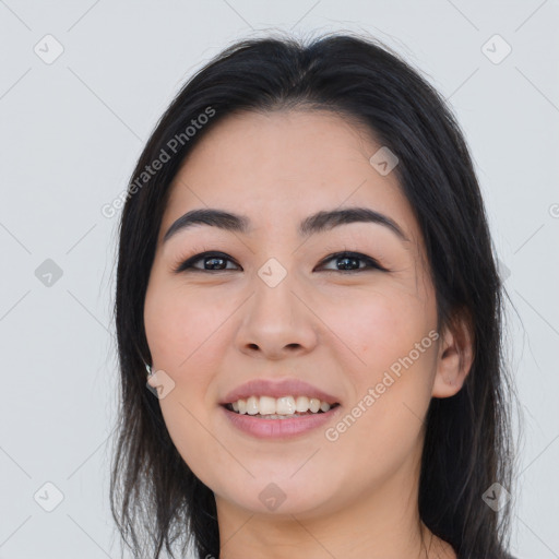 Joyful asian young-adult female with long  black hair and brown eyes