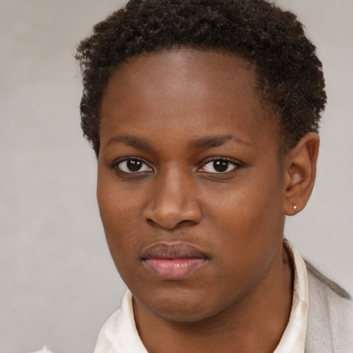 Neutral black young-adult female with short  brown hair and brown eyes