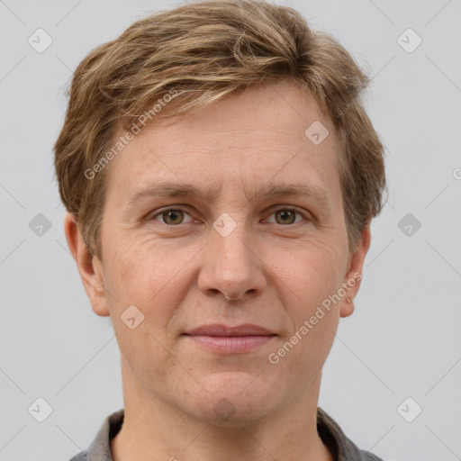 Joyful white adult male with short  brown hair and grey eyes