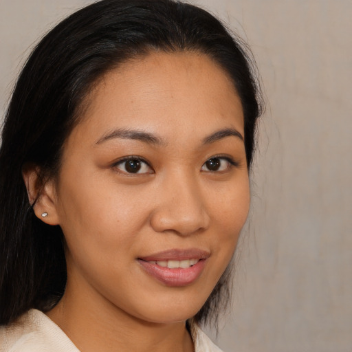 Joyful asian young-adult female with medium  brown hair and brown eyes