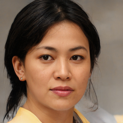 Neutral asian young-adult female with medium  brown hair and brown eyes