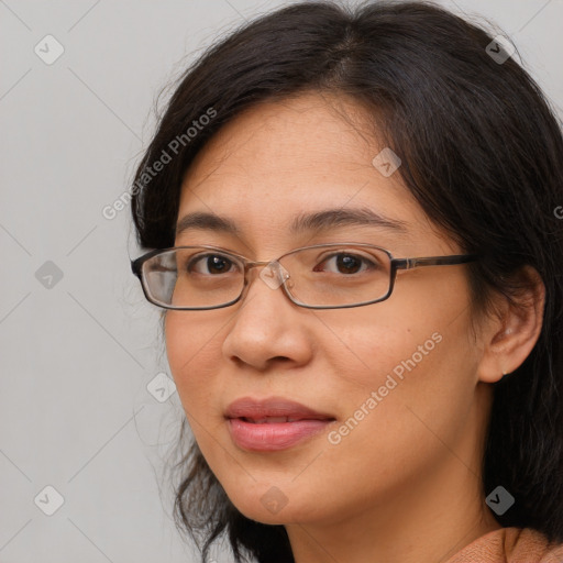 Joyful white adult female with medium  brown hair and brown eyes