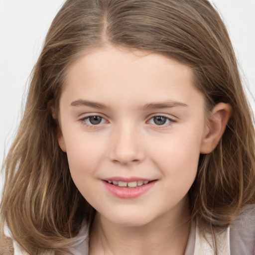 Joyful white child female with long  brown hair and brown eyes