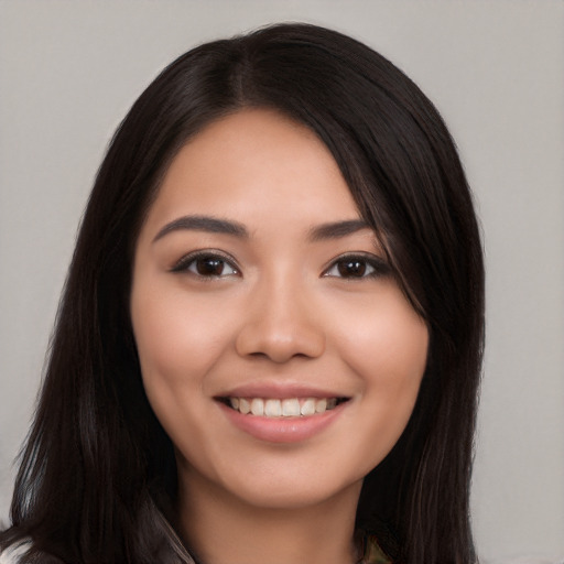 Joyful white young-adult female with long  black hair and brown eyes