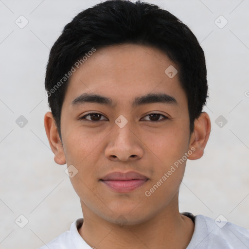 Joyful asian young-adult male with short  black hair and brown eyes