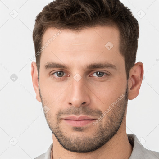 Neutral white young-adult male with short  brown hair and grey eyes